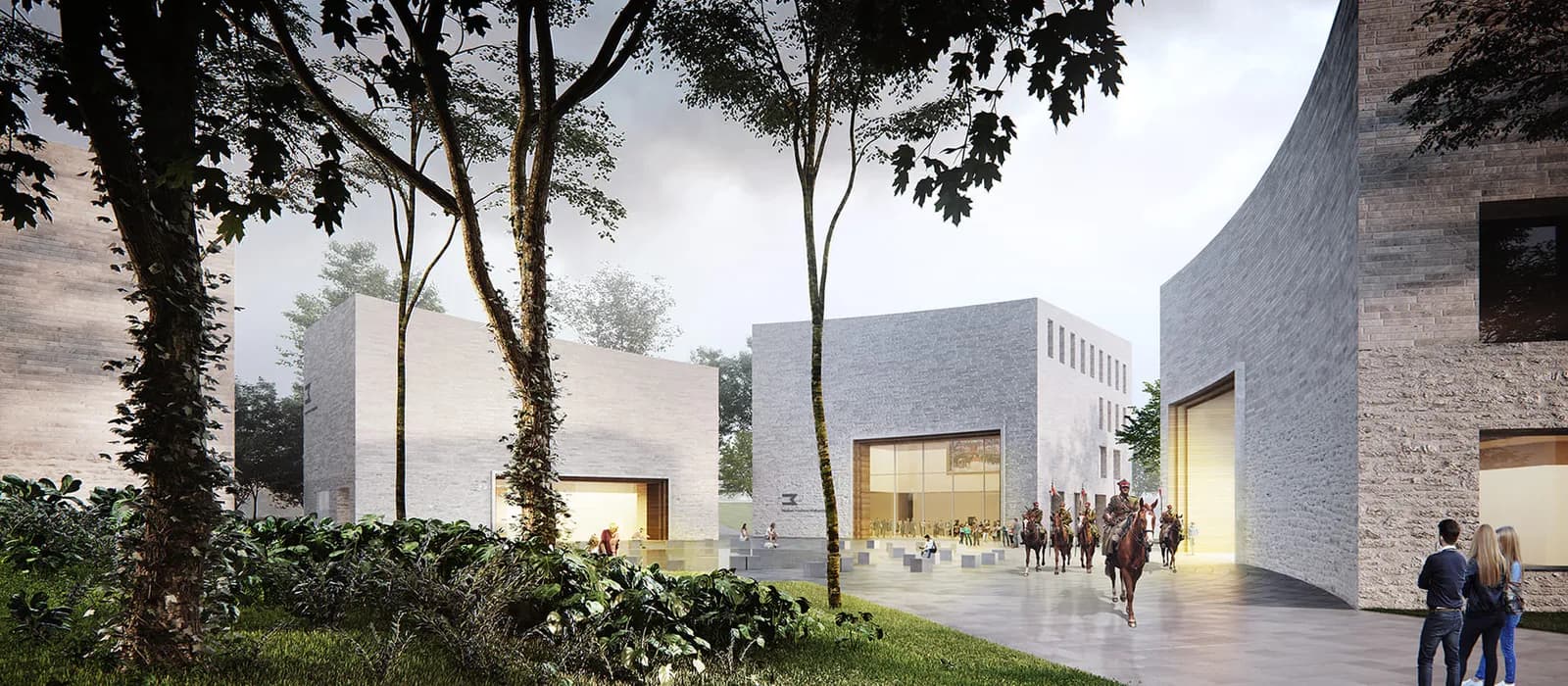 A modern building complex with grey brick facades and large windows is surrounded by trees and lush greenery, with people on horseback and on foot gathering on a paved area in front.